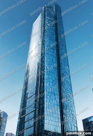 futuristic glass skyscraper against a cl